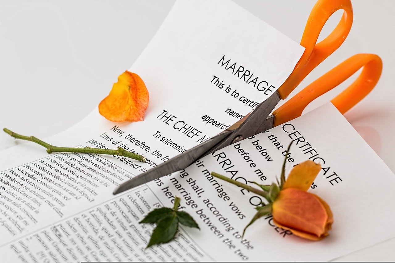 Marriage certificate being cut up for a divorce
