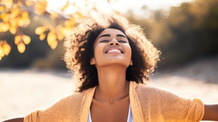 Woman looking up at sky grateful after divorce