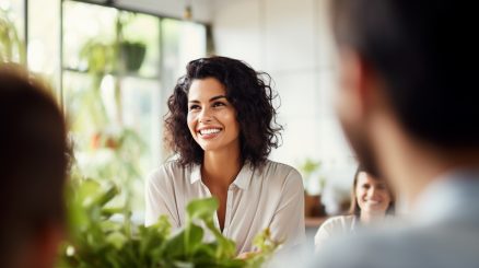 Woman smiling while interacting with others